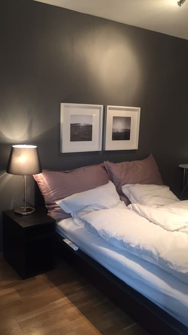Bedroom with queen size bed, Smart TV and desk
