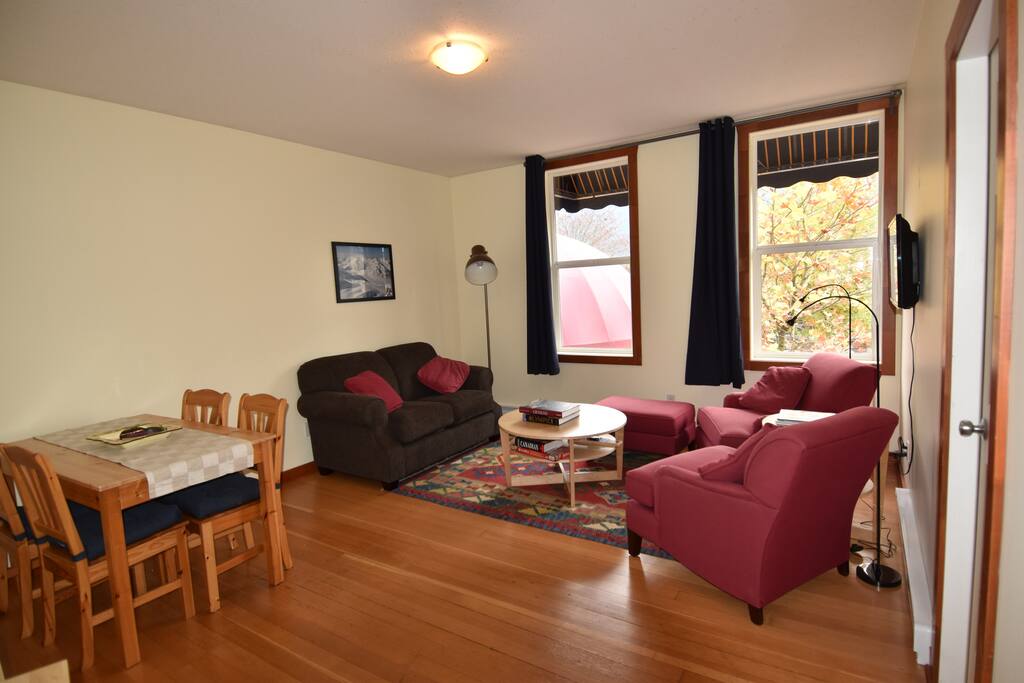 Natural light pours in from the large windows, every cozy seat has a reading light.