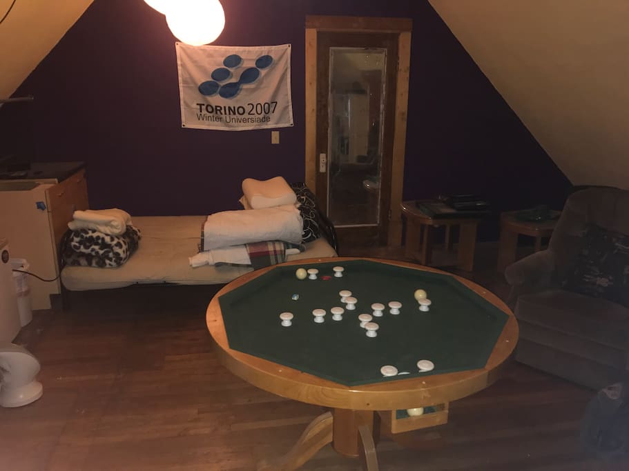 Game room including pool table and foosball.