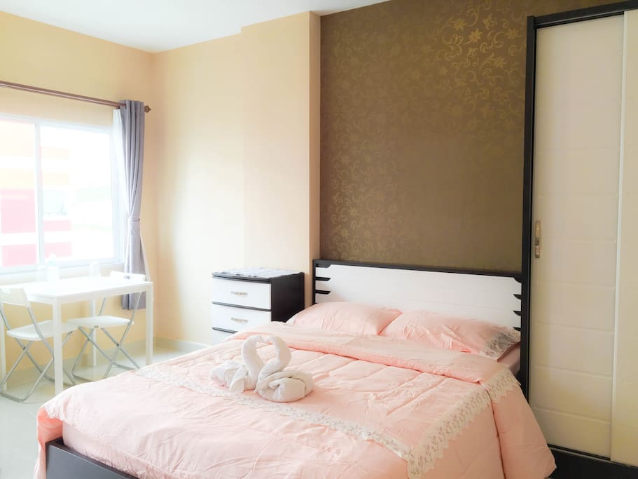 Bed with bedcover and table