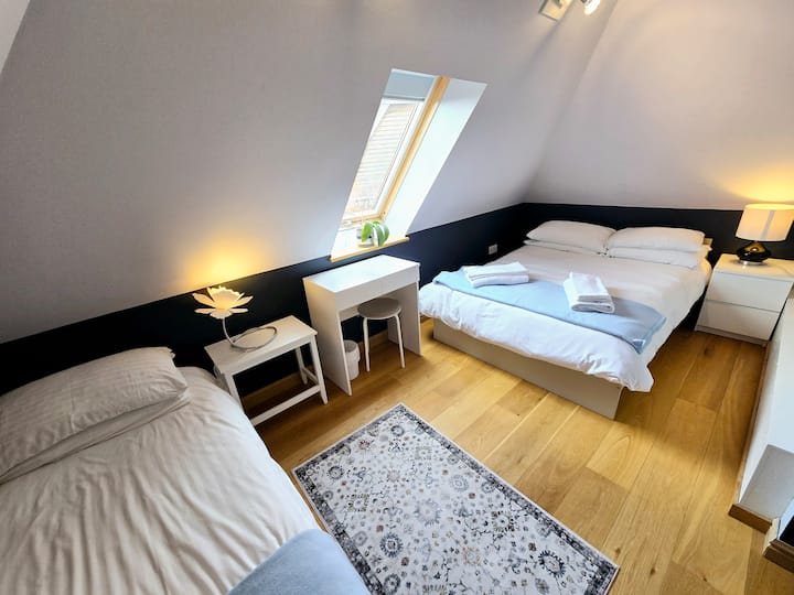 First floor bedroom with one double bed and one single bed. Shared shower room next door