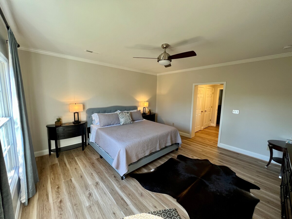 Guest Bedroom 2 with King size bed and enormous amount of closet/storage space in walkway leading in. 