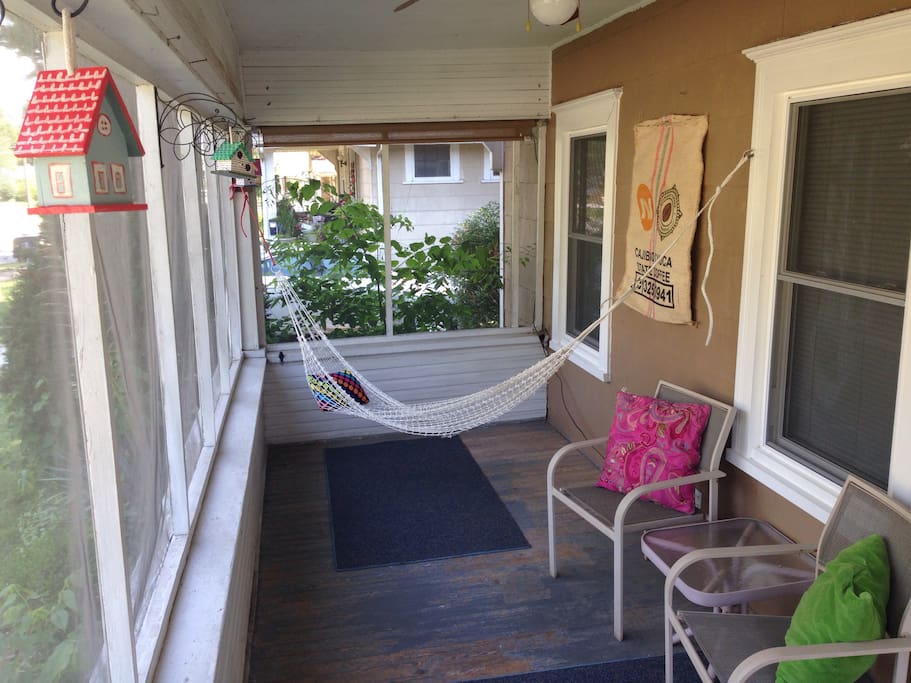 A hammock and chairs in the screened in porch make for bug-free r and r.