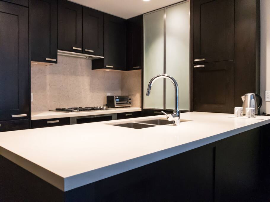 Kitchen (includes dish soap, cups, glasses, plates, bowls, utensils, cutting board, kettle, pots & pans, blender, toaster oven, stove, microwave, fridge, freezer and more!)