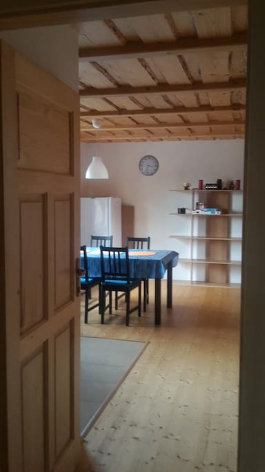 Ground floor from the main entrance. Fridge and dining table