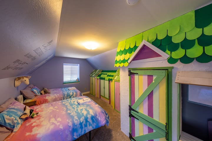 Bedroom 4 has 2 full beds and a twin bed