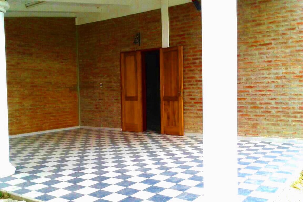 The entrance of the house. Table to set outside for parties or big dinner available