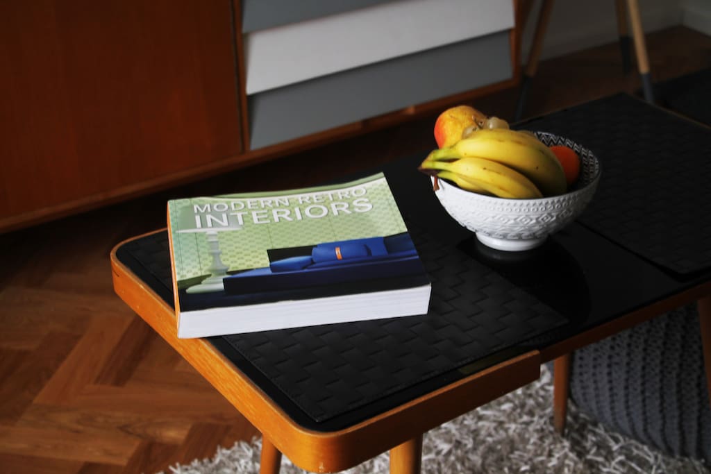 Coffee table with design book that inspired the interior of the apartment