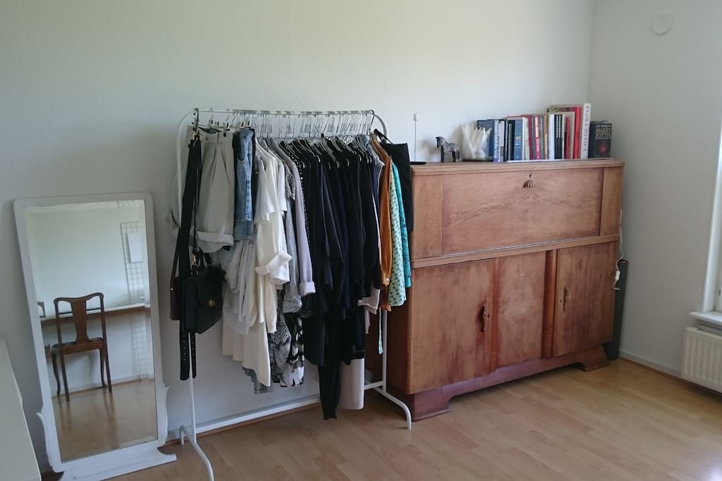 My garderobe, cooking books and mirror.