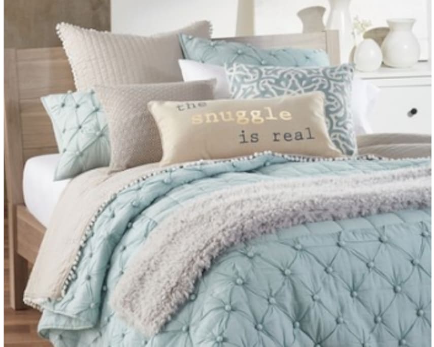 Cozy bed with down comforter