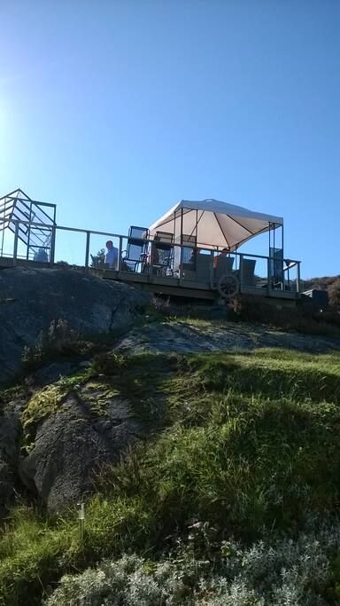 Terrace on the mountain with the greenhouse and pavilion .