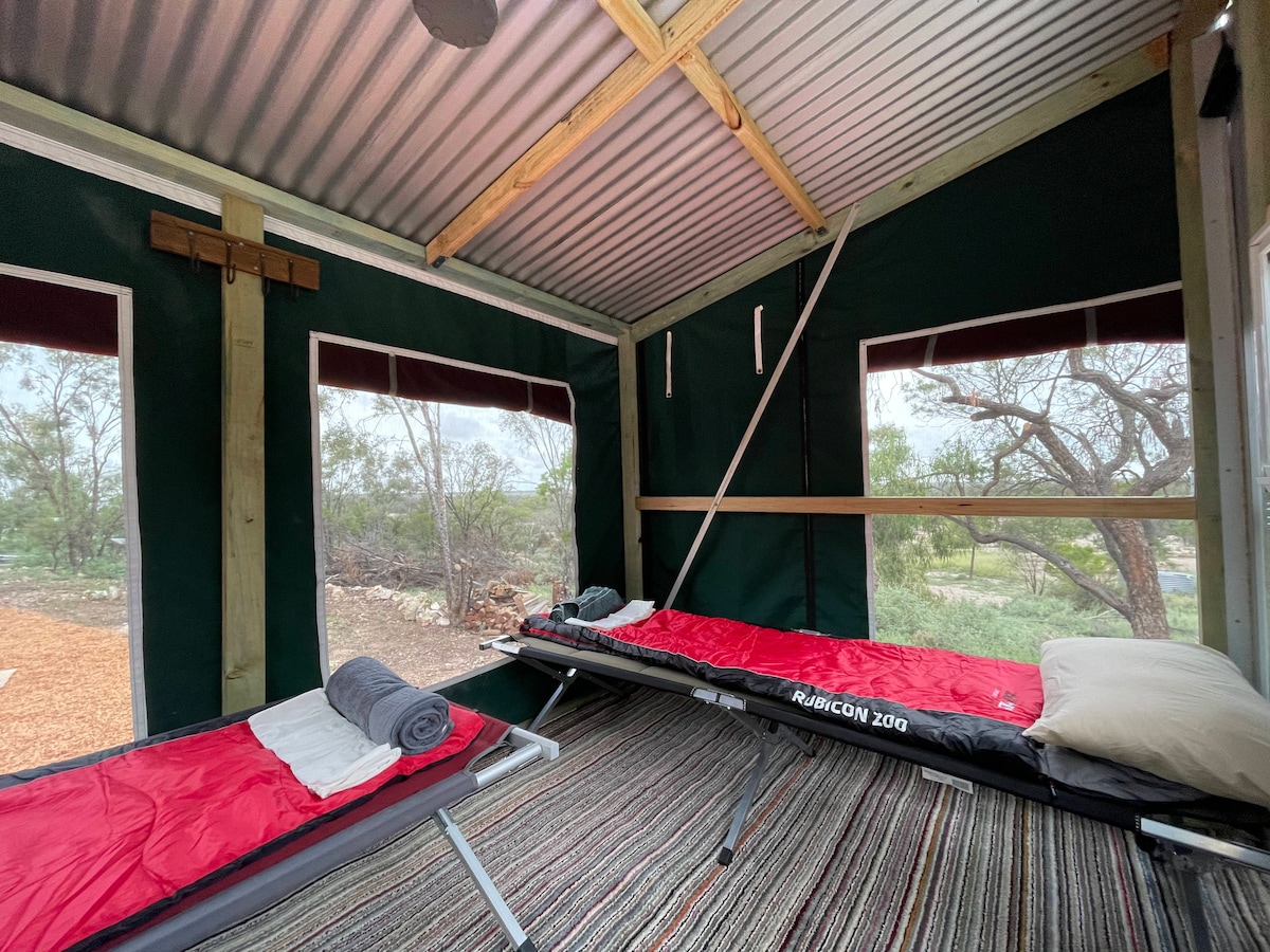 The Cabana. Stretcher beds. Sleeping bag, pillow, inner sheet and towel.