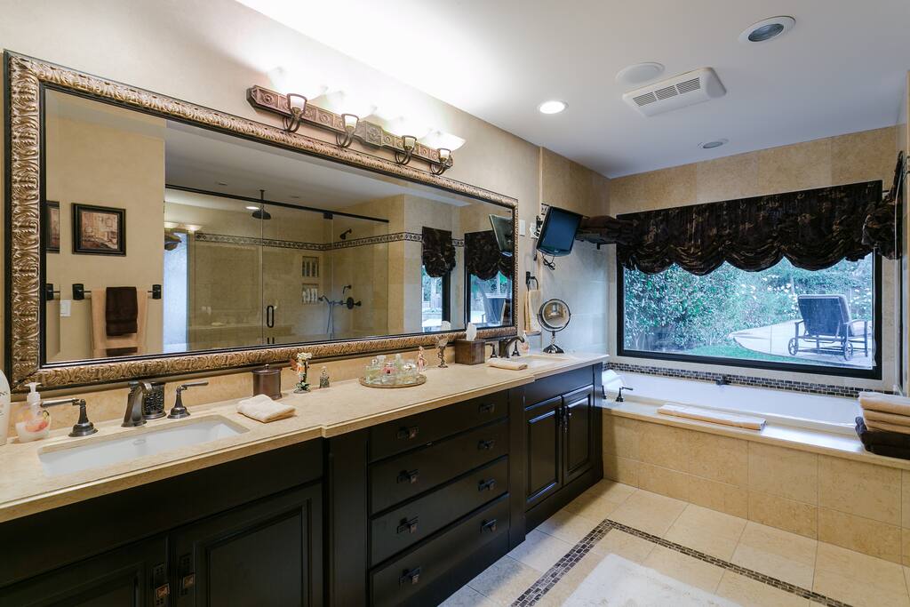 Lavish in the beauty of your master bathroom, where you will find a luxurious and spacious Egyptian limestone shower and wonderful soaking tub....Awe!