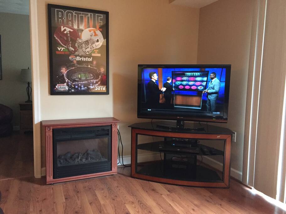 Great TV and a small electric fireplace will take the chill out of the air or just use the light for ambience.