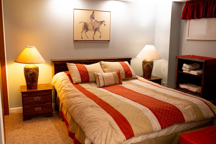 Bedroom 1 has a queen bed, large closet,  dresser, and a door to the bathroom with shower.  