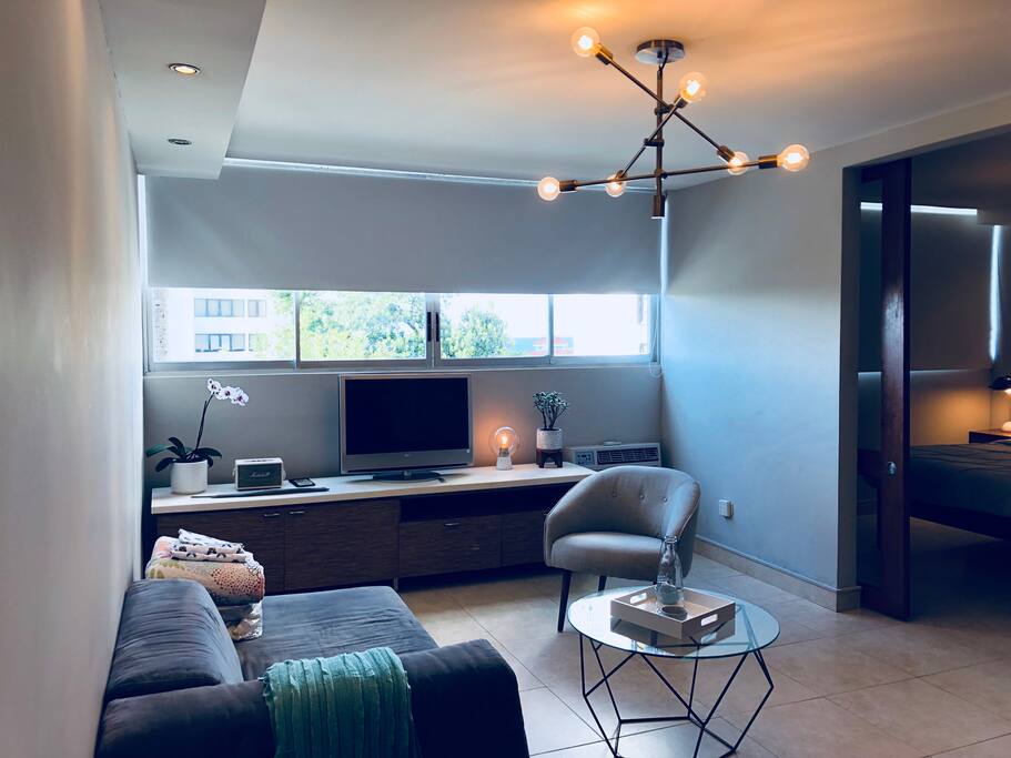This comfy and cool living room is waiting for you to come hang and enjoy all of its fun amenities which include: Wifi, Apple TV, and a Marshall speaker in which to enjoy all of your favorite music. Turn the couch into a comfy Twin sizes bed with a comfy mattress pad and fresh linens! The view to the Ocean will have you relaxing all day! Enjoy!