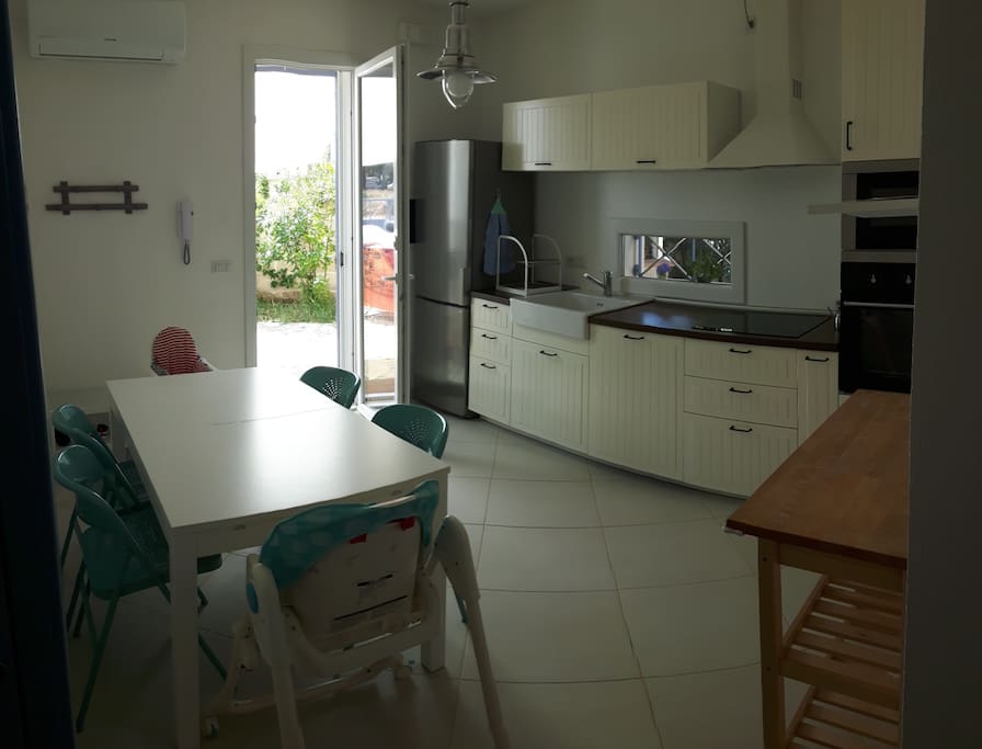 Kitchen with A/C , child and babychairs.