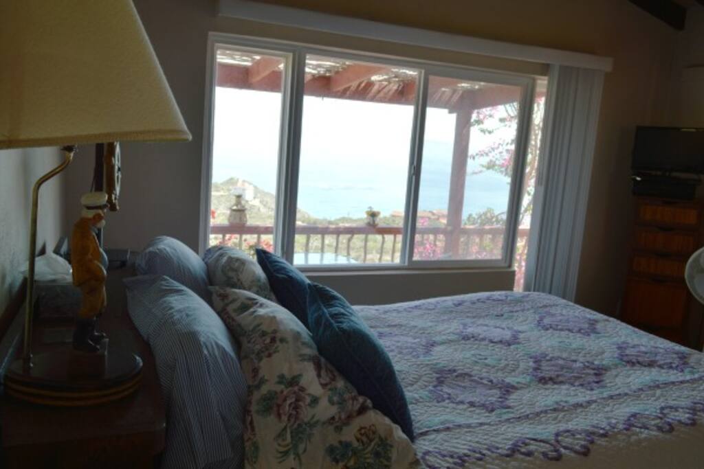 Comfortable queen bed with a great ocean view