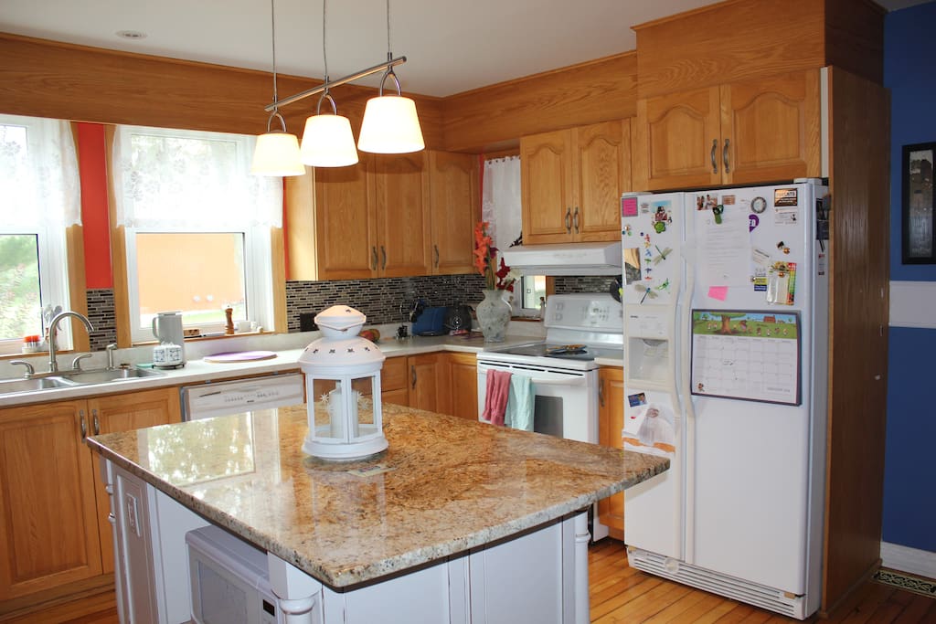 Perfect charming and spacious kitchen to invite family and guests over for a meal.