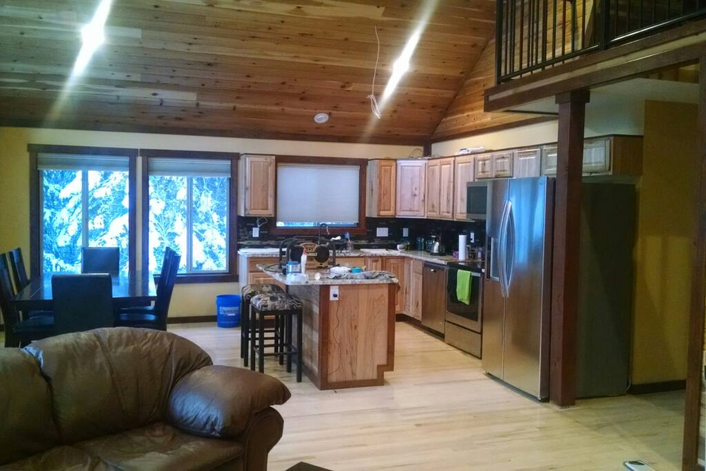 Open floor plan encompasses the kitchen, dining, and living areas. This area flows directly into the deck and is overlooked by the loft.
