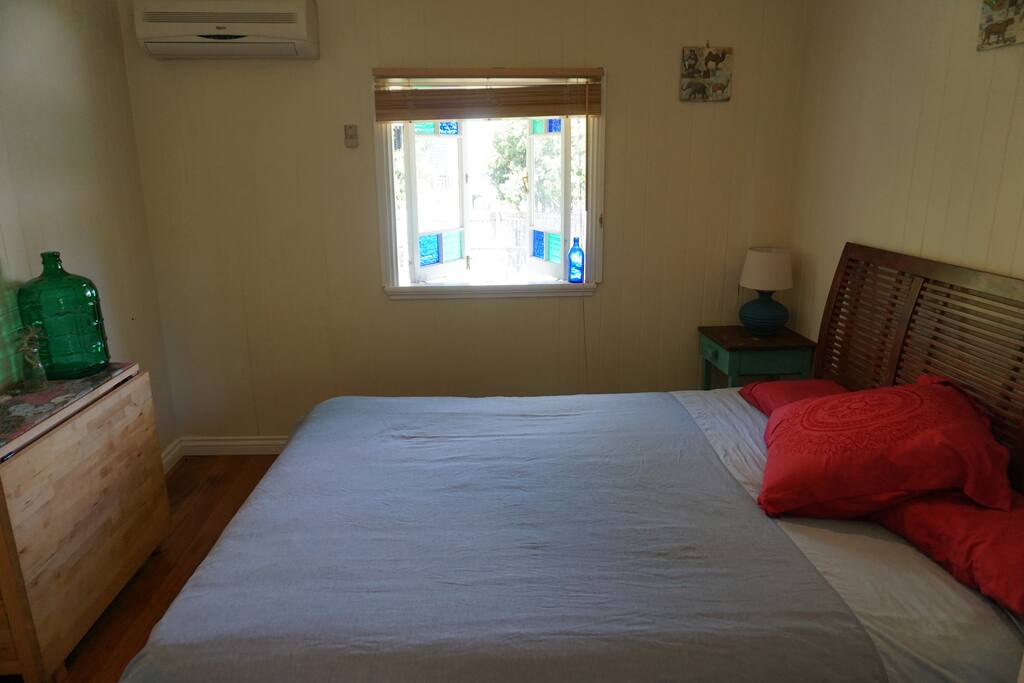 Bedroom One - Light and spacious, with a built-in wardrobe.