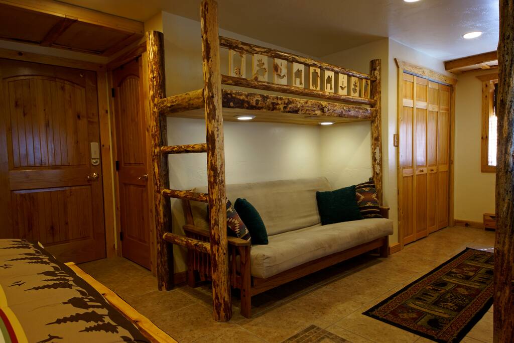 The futon can be used as a couch or it can be folded down into a double bed, which increases the occupancy to about eight, including children.