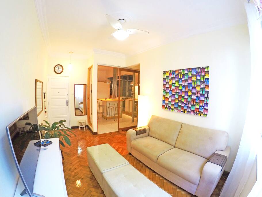 View of living room looking toward the kitchen with flatscreen TV