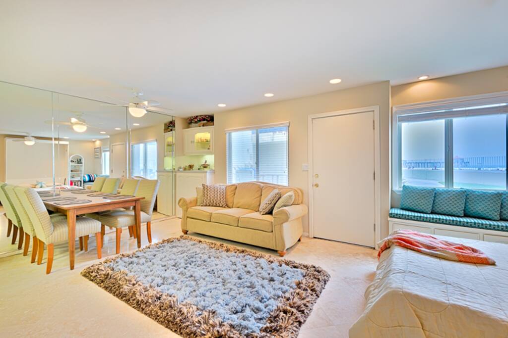 Wake up to the cool ocean breeze and views of the surf and pier.
