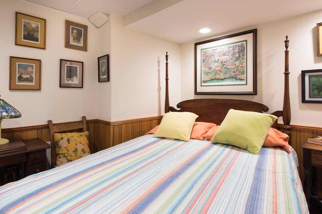 Comfortable and colorful four poster bed in private bedroom
