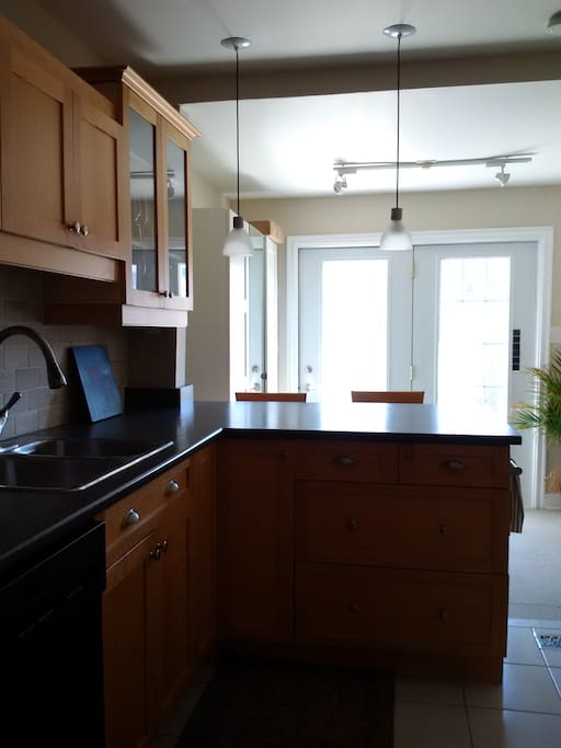 Large kitchen with walk out to deck