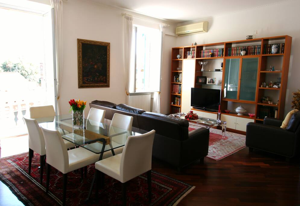Flat screen tv and leather Poltrona Frau couch