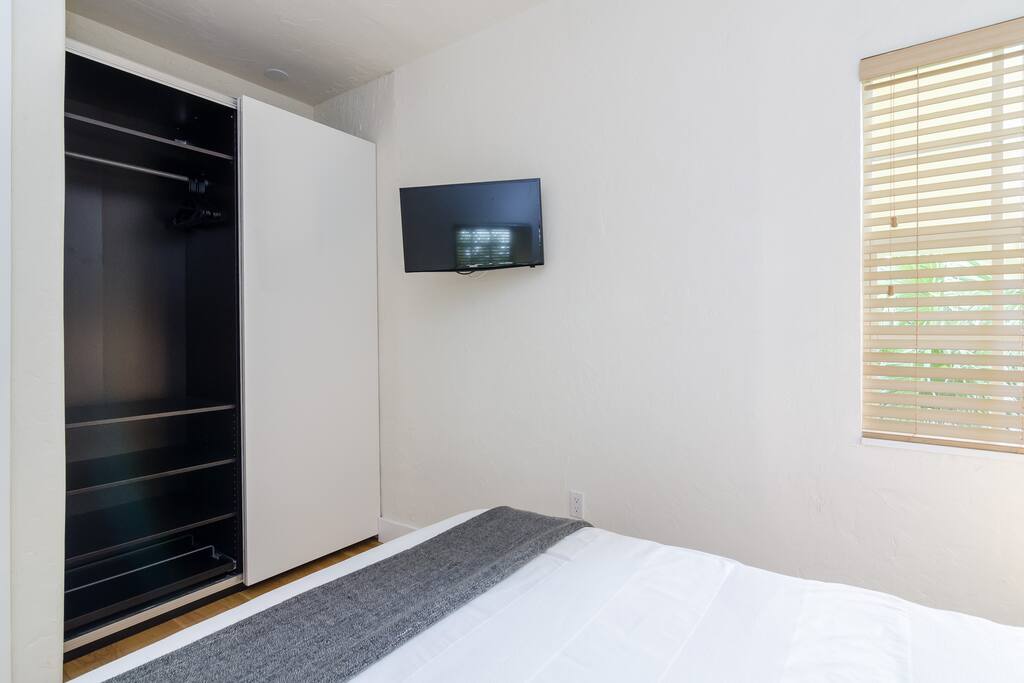 Zebra room has a large closet with storage space on top for suitcases. It also has a 28" adjustable TV.