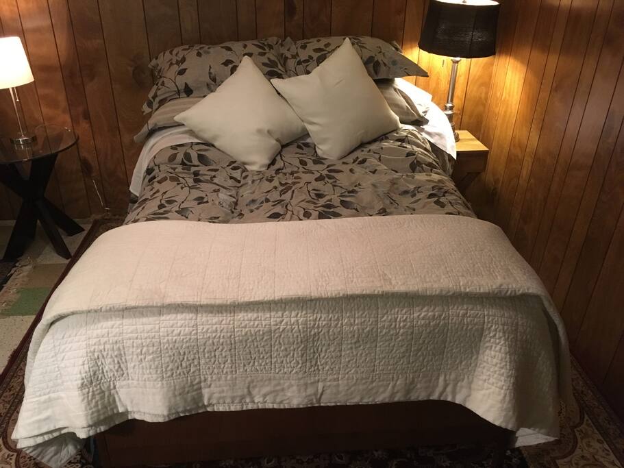 The bed is full size. Fresh, clean sheets with lots of blankets and pillows.