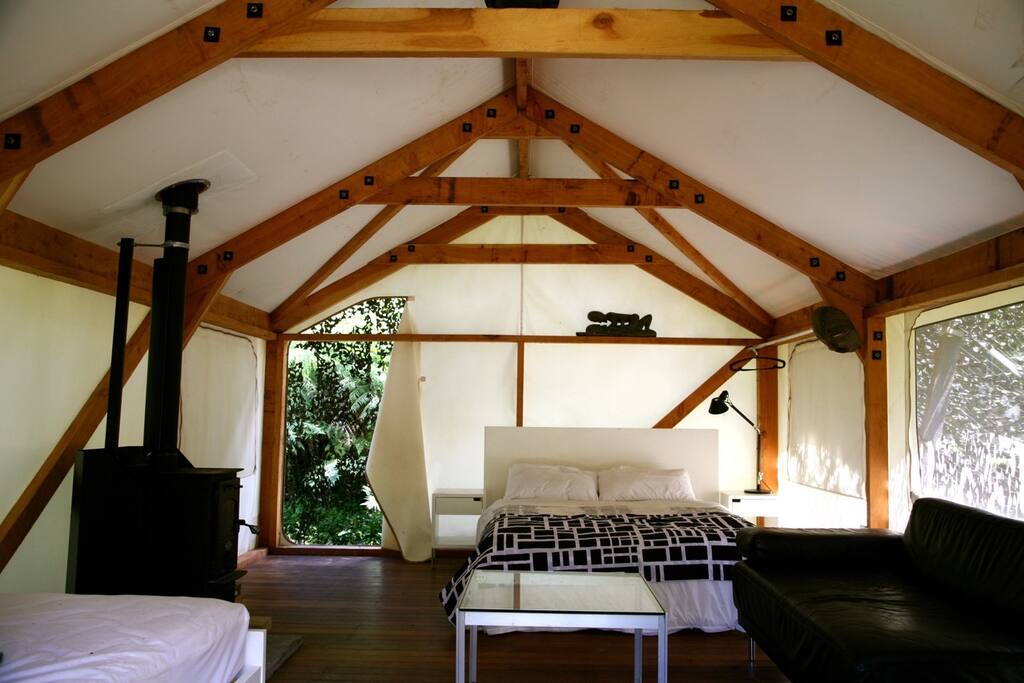 Queen sized bed inside tent