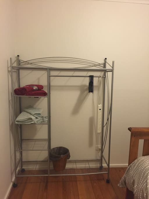Clothes hanging space and towels provided.