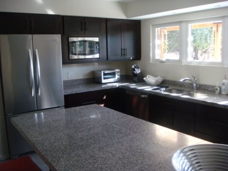 Fully stocked kitchen for entertaining or enjoying a meal poolside