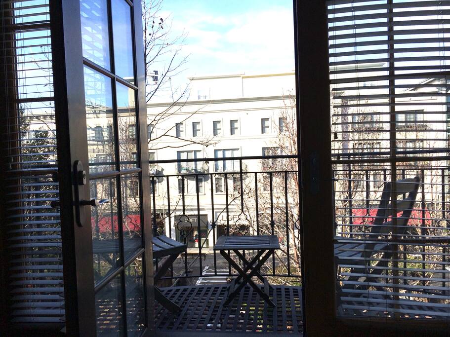 Outdoor patio that easily fits 2 facing out into Santana Row