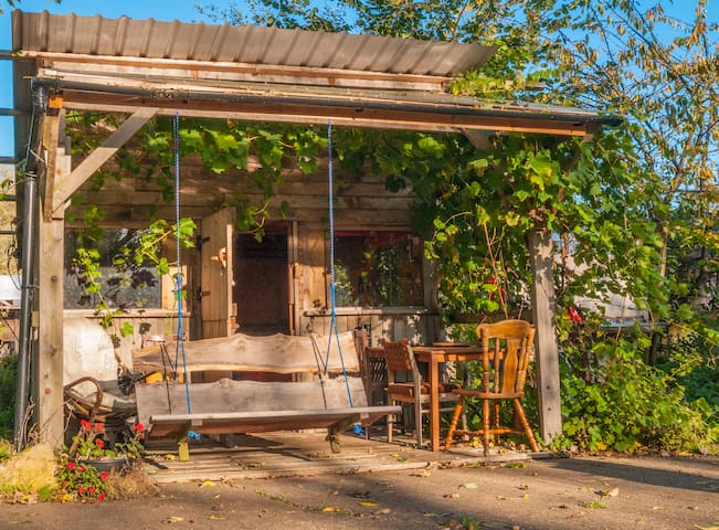 Wooden cabin by river in rural Leicestershire.