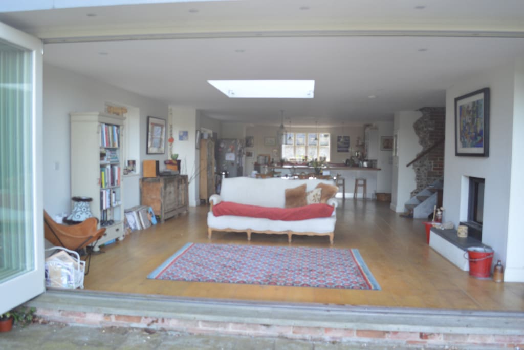 Main sitting area with dining area behind