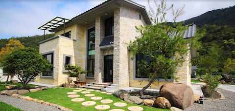 "One 4-person room () and 3 double rooms + kitchen living room"