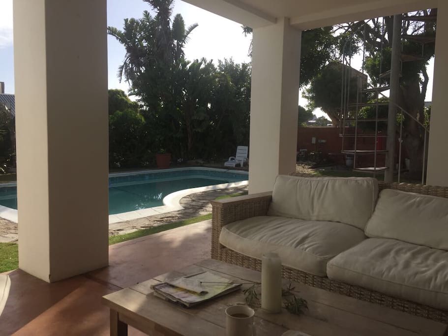 Garden with swimming pool and barbecue facilities to relax and unwind.