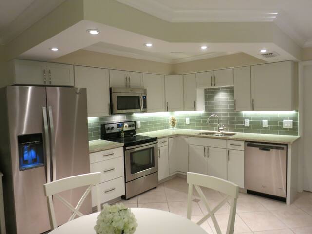 Coastal Contemporary Condo steps to the beach!