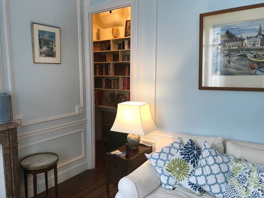 Living room looking into hallway to single bedroom