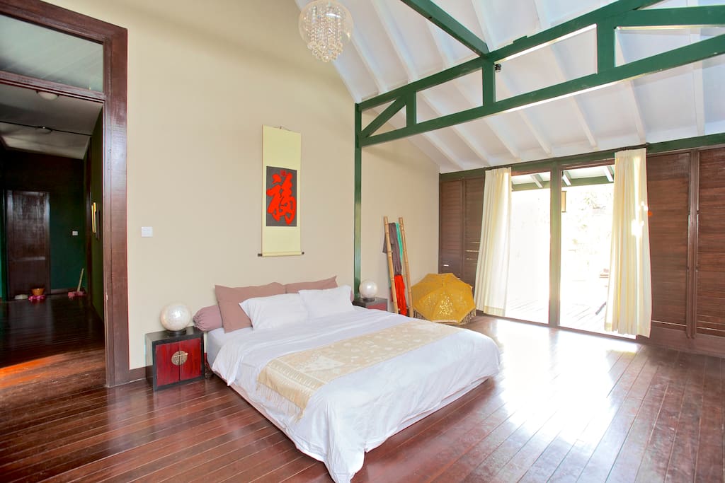 Master bedroom opening to the garden, king size KingKoil Mattress.