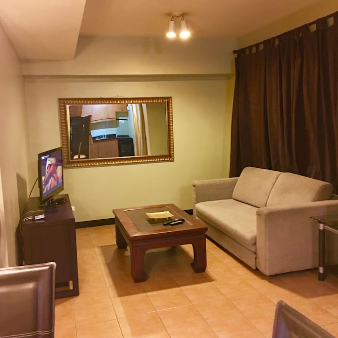 Living room with 36" flat screen TV and cable channels and Internet
