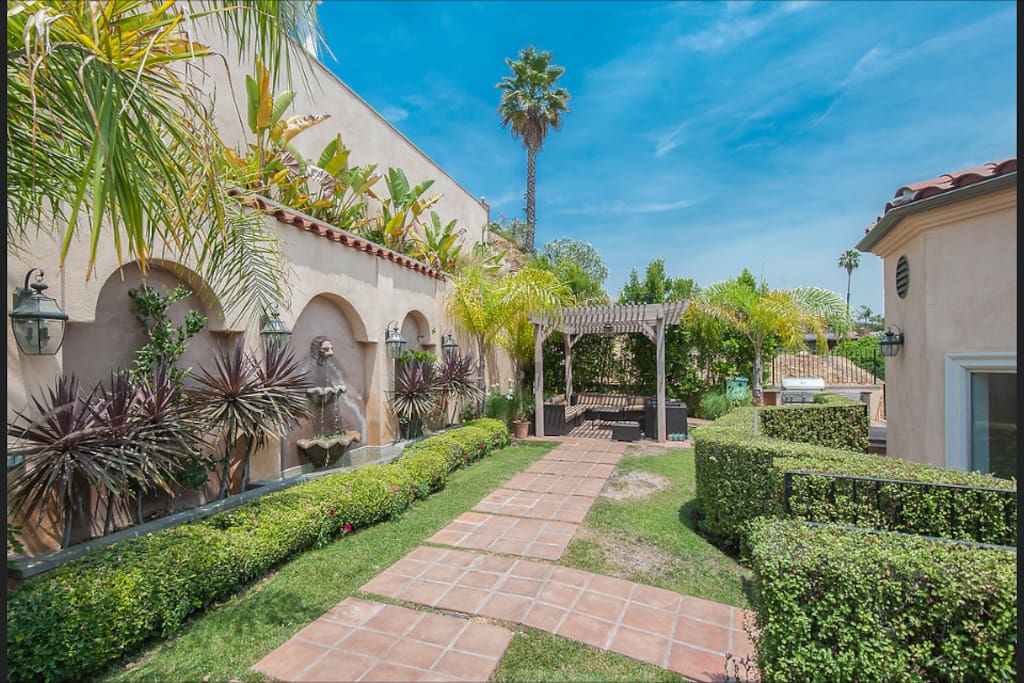 BACKYARD: Sitting areas with fountain, jacuzzi and private entrance for Imagination Guest Room. Also access to the views of the Hollywood Sign and panoramic city views.