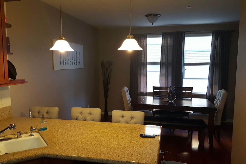 Coszy dining area with extra seating at counter area.