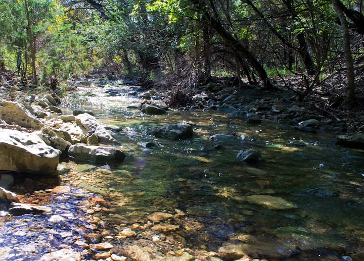 You'll cross a low water crossing over Pierce Creek, a wet-weather creek, on the drive in. It runs through the front of our 5 acre property. Wet-weather creeks only run when there's been significant rain and are dry during dry spells.