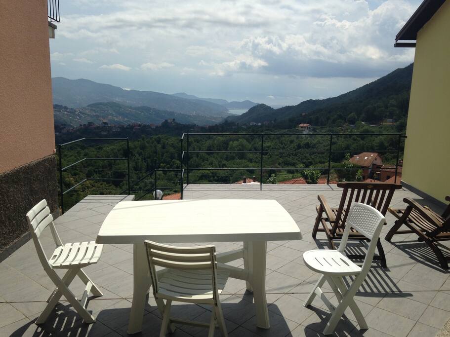 Bright terrace with view to the coast, here you can eat and relax sunbathing