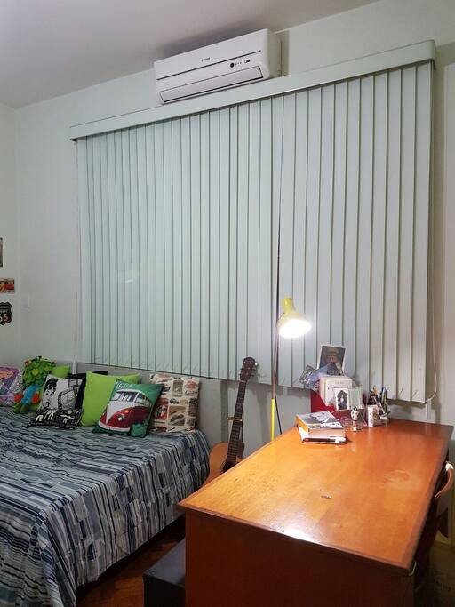Desk, double bad, and air conditioner